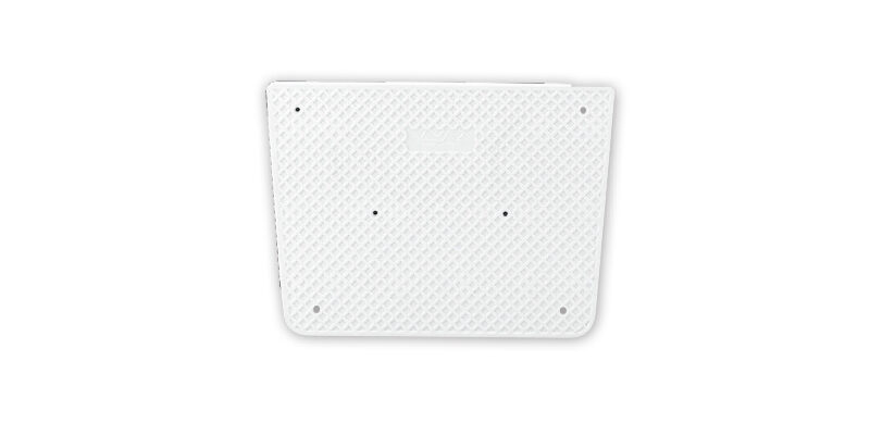 White textured rectangular object with small holes on a plain background.