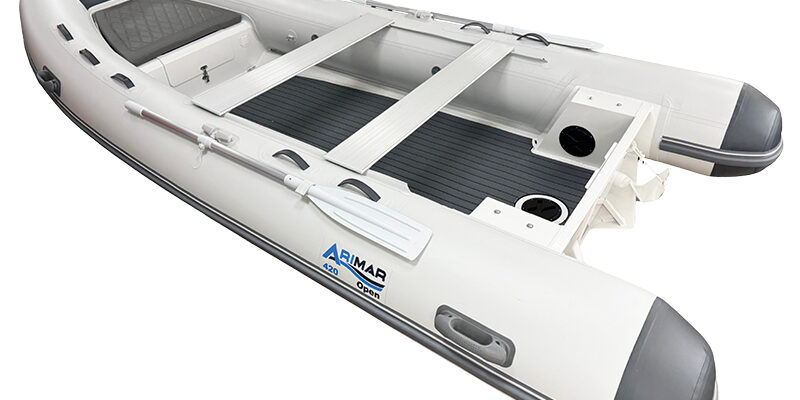 Export 420 Inflatable white boat with gray accents, featuring ARIMAR branding, paddles, and seating, ideal for water adventures.