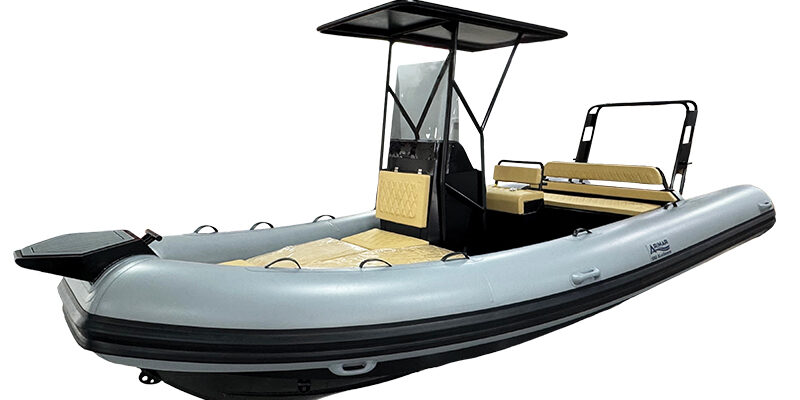 Xcellence 520 Inflatable RIB boat with canopy and seating, isolated on white background, ideal for marine activities.