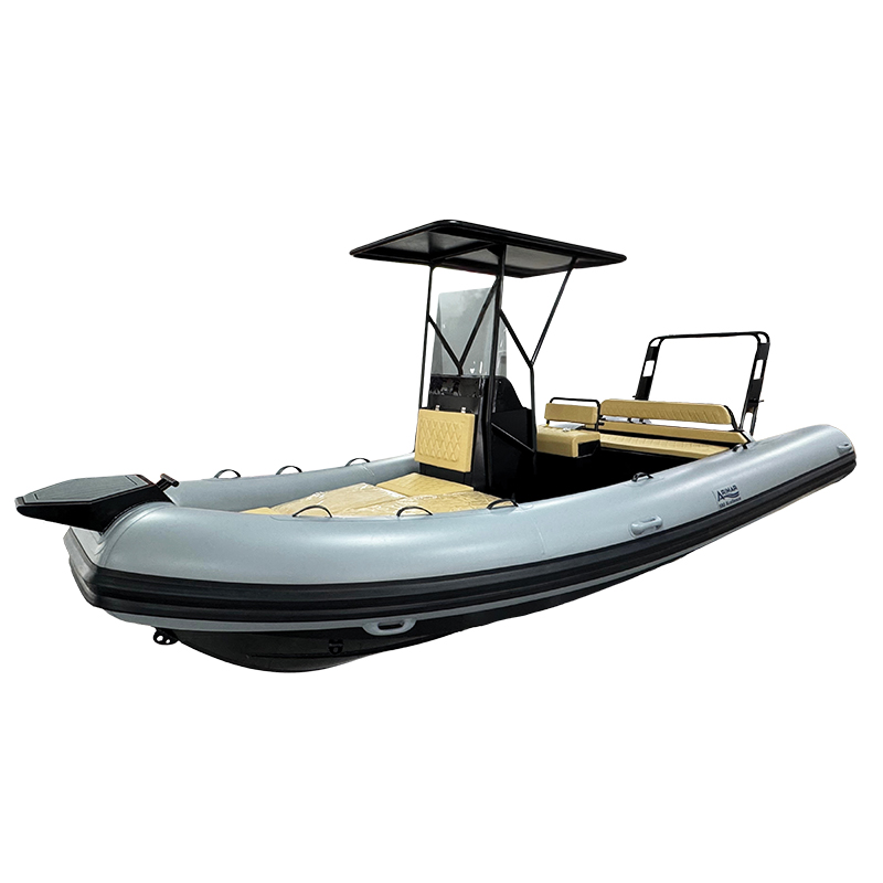 Inflatable RIB boat with canopy and seating, isolated on white background, ideal for marine activities.